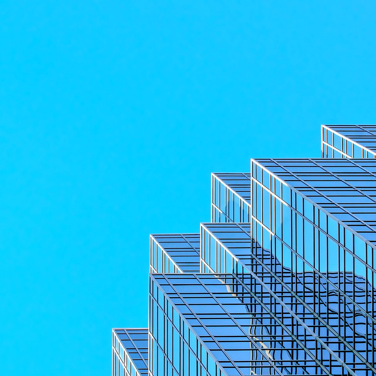 Glass office tower with a stepped facade